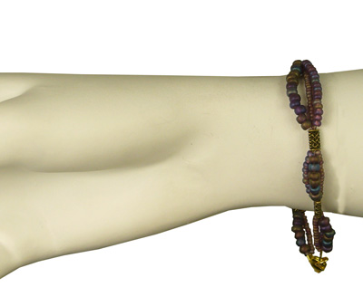 Celtic bracelet with mauve and earth coloured beads