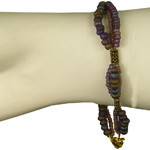  Click to view Celtic bracelet with mauve and earth coloured beads